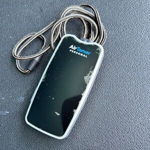 Black Wearable AirTamer with Sleek Design and Minimalist Aesthetic